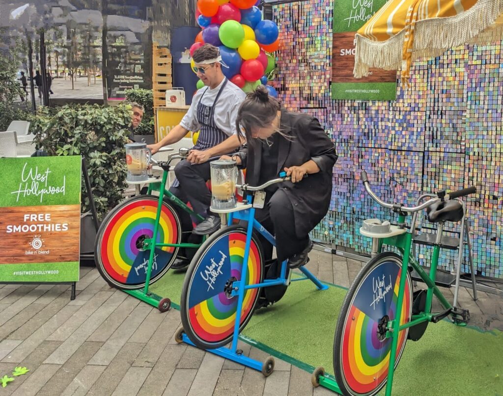 Two at a conference expo pedalling for smoothies
